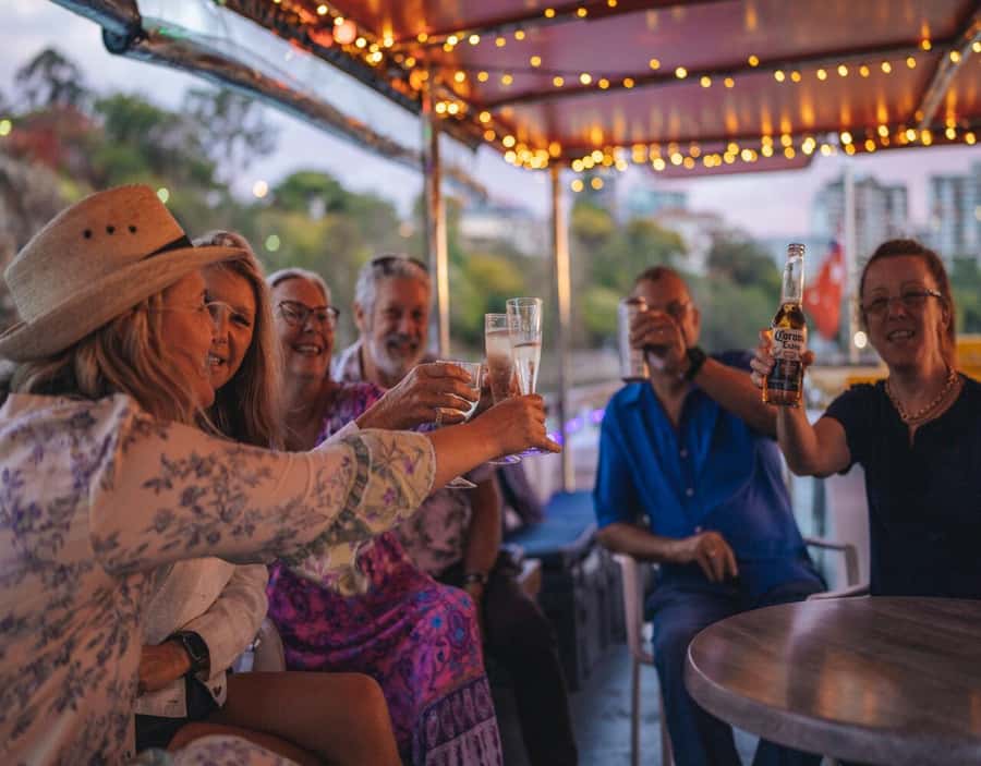 Brisbane: Sunset City Lights Cruise 5.30pm or 6pm <em>seasonal – Key points to know before boarding’ /></p>
<ul>
<li><strong>The timing changes by season:</strong> Depart at 5.30pm from April through September, or 6pm from October through March.</li>
<li><strong>Sunset and city lights share the itinerary:</strong> You may see the last daylight at the start and Brisbane glowing by the return trip.</li>
<li><strong>Story Bridge and Kangaroo Cliffs are the headline views:</strong> The route focuses on Brisbane River scenery rather than a long list of stops.</li>
<li><strong>A complimentary charcuterie board is included:</strong> Drinks and extra snacks cost more and are bought at the onboard bar.</li>
<li><strong>There is no live commentary:</strong> Music sets the mood, but landmark details are not part of the cruise.</li>
<li><strong>The Cultural Centre pontoon is the meeting point:</strong> You board at South Bank, in front of the cultural centre, 15 minutes before departure.</li>
</ul>
<h2 id="why-an-evening-cruise-works-so-well-in-brisbane">Why an evening cruise works so well in Brisbane</h2>
<p><img width="900" height="675" decoding="async" src=