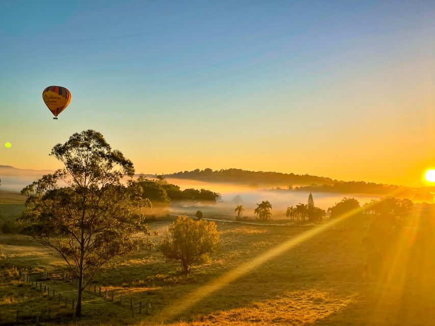 Byron Bay: Sunrise Hot Air Balloon Flight with Breakfast - Rising above Byron Bay as the sun appears