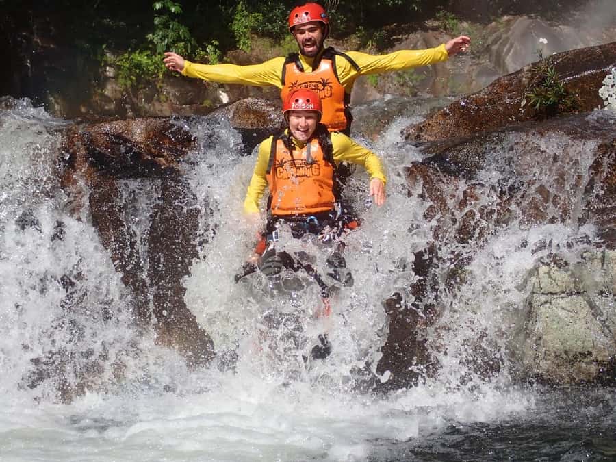 Cairns: Behana Gorge Rainforest Canyoning Tour - Rock jumps, natural slides, and water chutes