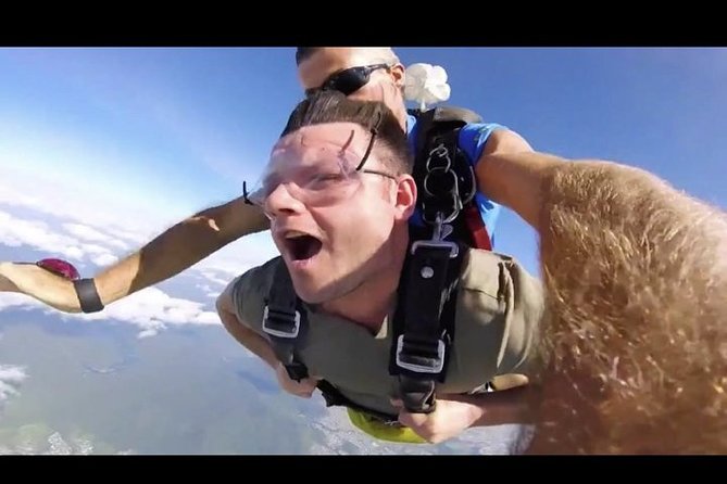 Cairns: Tandem Skydive Experience over Reef & Rainforest - Timing, transport, and group size