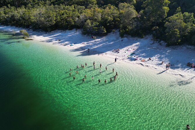 Dingos 2 Day K'Gari (Fraser Island) 4WD Tag-Along Tour - Crossing the barge and following the beach