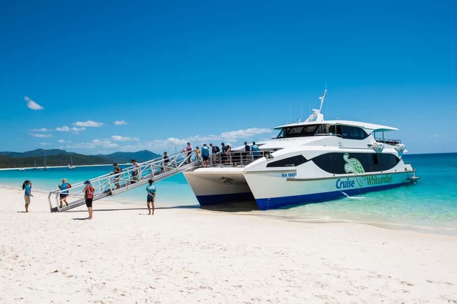 From Airlie: Whitsundays and Whitehaven Half-Day Cruise - Crew service and commentary shape the day