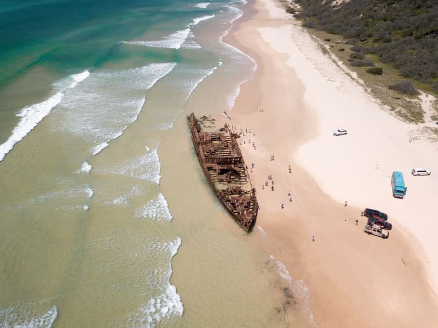From Hervey Bay: K'gari, Fraser Island Full-Day Coach Tour - 75 Mile Beach, Eli Creek, and the Maheno Wreck