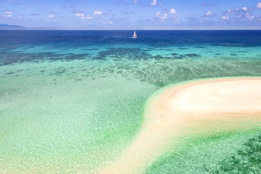 From Port Douglas: Outer Reef Cruise by Luxury Catamaran - Arriving at Mackay Cay and the first reef site