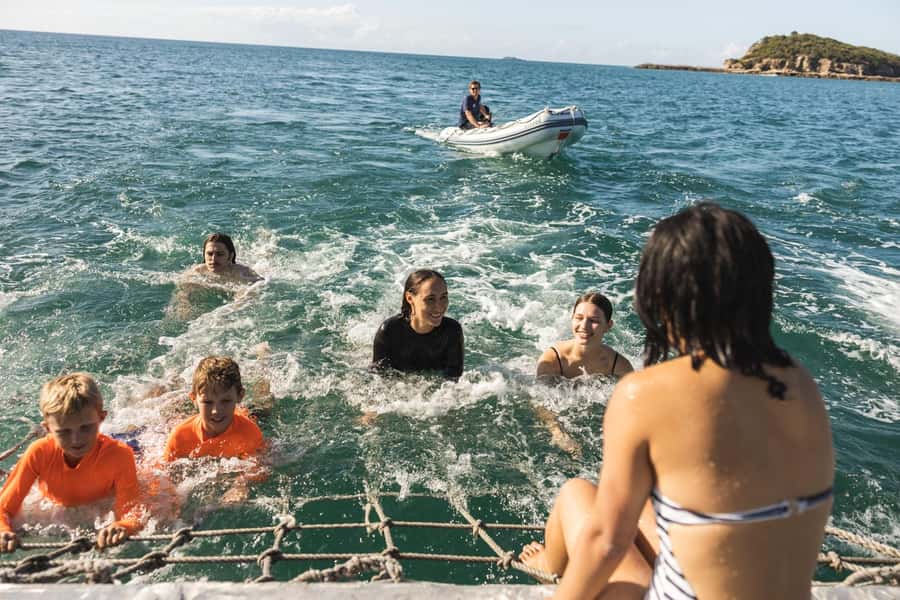 From Rosslyn: Great Keppel Island Adventure Tour with Lunch - Looking through the glass-bottom boat