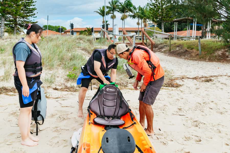 Gold Coast: Wave Break Island Kayaking & Snorkeling tour - Snack time with the Gold Coast skyline