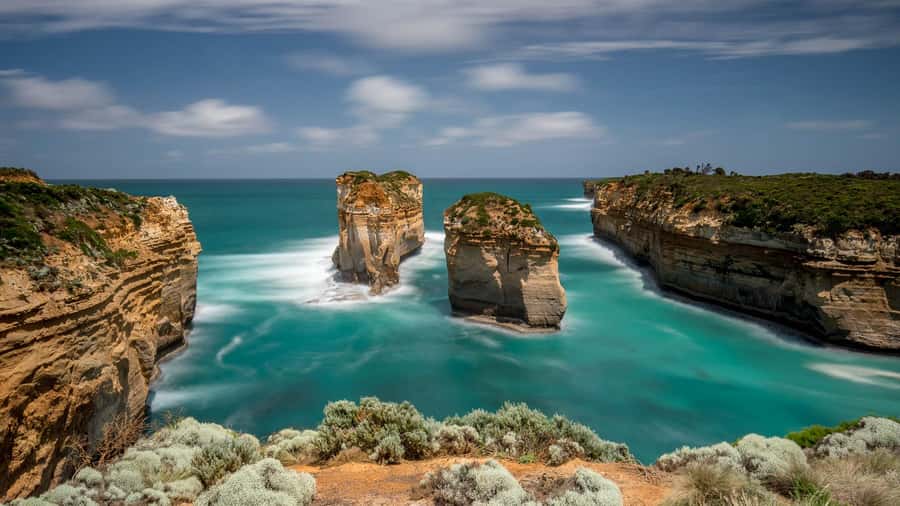 Melbourne: Great Ocean Road & Wildlife Tour for Backpackers - Standing below the cliffs at Gibson Steps