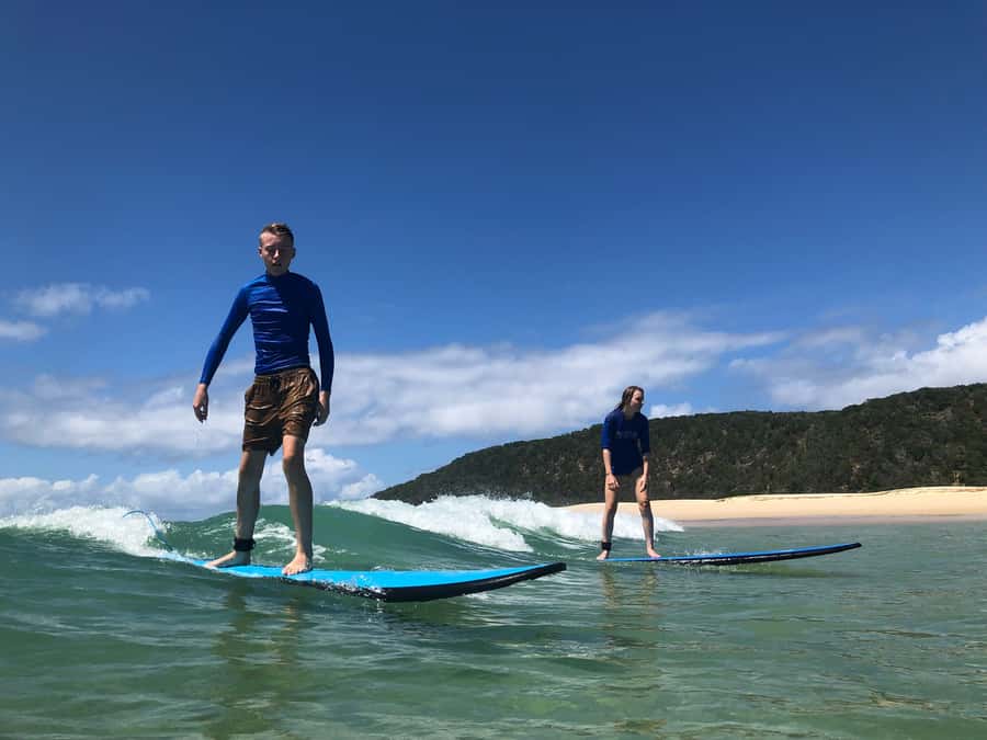 Rainbow Beach: 4WD Beach Drive Adventure and Surf Lesson - Reaching Double Island Point by beach