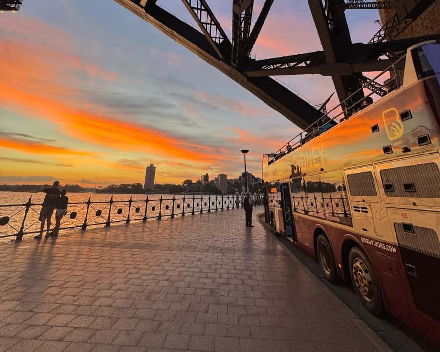 Sydney: Big Bus Panoramic Night Tour by Open-Top Bus - Crossing Harbour Bridge with the lights below