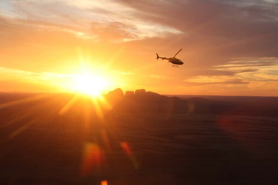 Yulara: Uluru and Kata Tjuta Sunset Helicopter Tour - The flight toward the sacred rock